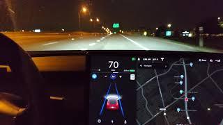 Tesla stopping on highway for red light below